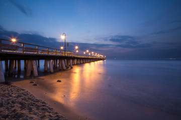 Sunrise on the pier at the seaside, Gdynia Orlowo, Poland - obrazy, fototapety, plakaty
