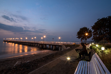 Sunrise on the pier at the seaside, Gdynia Orlowo, Poland - obrazy, fototapety, plakaty