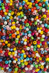 Fototapeta na wymiar abstract background of close up multi colored beads
