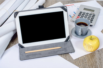 Digital tablet with a coffee and an apple on the desk