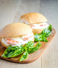 Classic prawn rolls on the wooden board