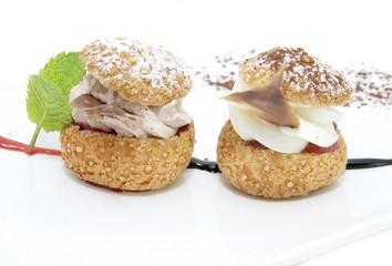 profiteroles with vanilla ice cream decorated