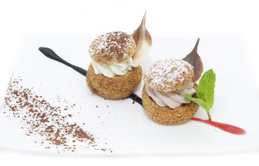 profiteroles with vanilla ice cream decorated