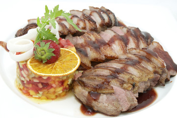 steak sauce and greens on a white background