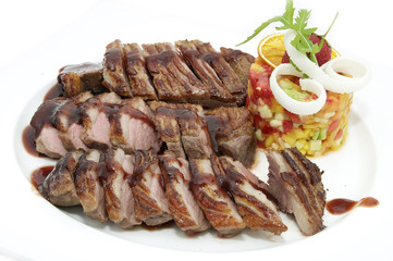 steak sauce and greens on a white background
