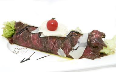 carpaccio with herbs and cheese on white background