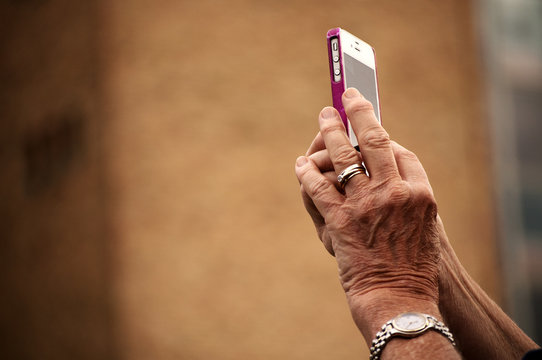 Old Woman Using Mobile Phone