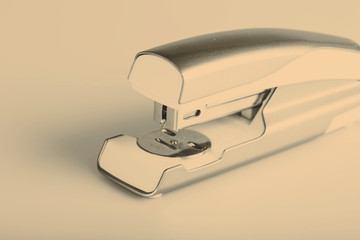 Light green stapler isolated on white