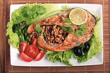 grilled salmon with salad and nuts