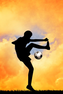 Soccer player at sunset
