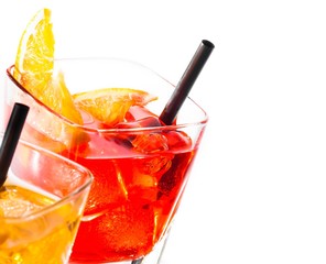 two cocktail with orange slice on top isolated