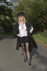 Mature university student in cap and gown