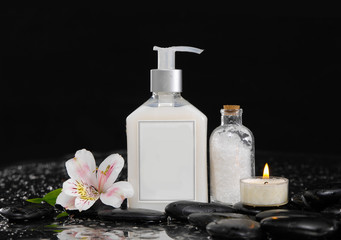 Still life with orchid ,massage oil, candle and zen stones
