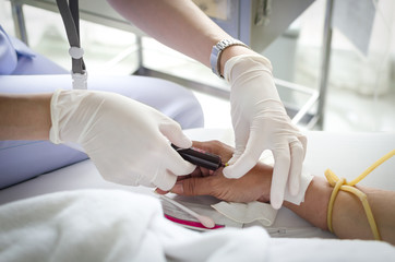 close up nurse taking a blood sample