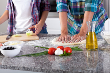 Couple preparing pizza