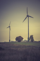 Fototapeta na wymiar Wind turbines silhouette in the sunset sky