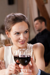 Young couple raising a toast