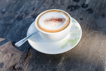 Coffee cup on wooden table