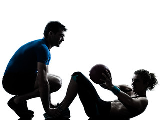 man woman exercising weights workout fitness ball silhouette © snaptitude