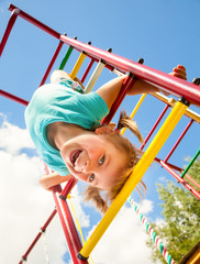 Happy child on a jungle gym