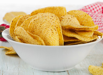Corn nachos chips on a wooden table