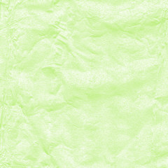 Obraz na płótnie Canvas background of crumpled foil painted pail green
