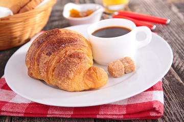coffee cup, croissant and orange juice