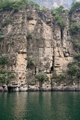 Steep high cliffs and the river at the bottom of the gorge.