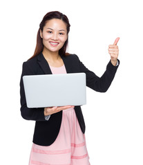 Businesswoman use of laptop computer and thumb up