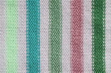 Knit woolen texture. Fabric striped background