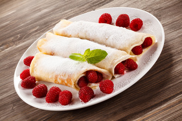 Pancakes with cream and raspberry