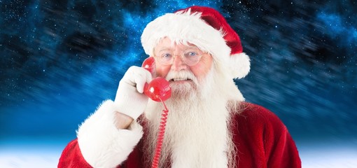 Composite image of santa claus on the phone
