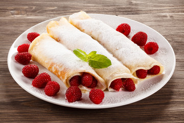 Pancakes with cream and raspberry