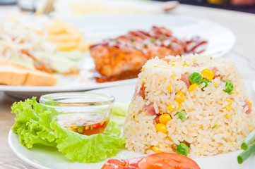 colorful fired rice on white plate