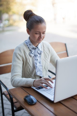 woman typing during work outdoor