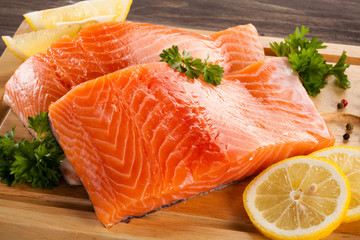 Fresh raw salmon fillet on cutting board