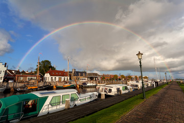 rainbow over boat at Zoutkamp harbor