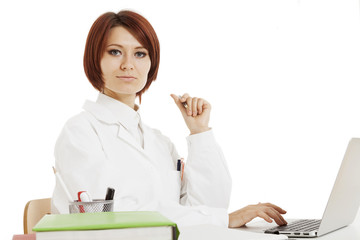 Doctor sitting behind her desk