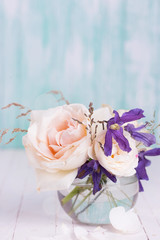 Fresh roses on wooden background