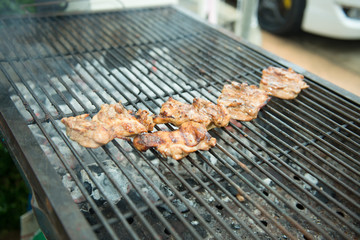 Grilled beef steaks and flaming grill