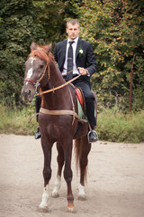 Obraz premium groom on horse