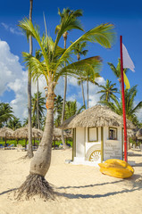 Exotic beach with hut and canoe on one of the Caribbean Islands