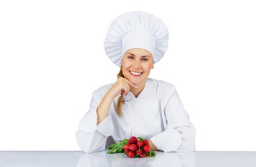 Chef woman. Isolated over white background by the table with veg