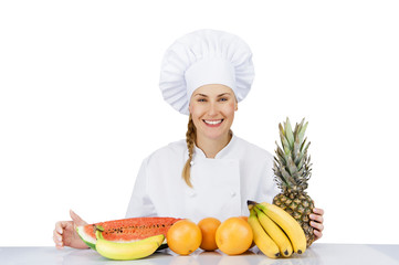 Woman chef over the table with fruits smiling. isoleted