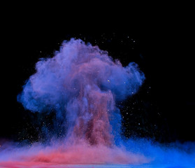 colored dust explosion on black background