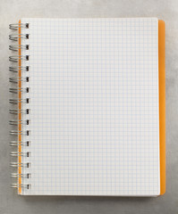 checked notebook at metal background