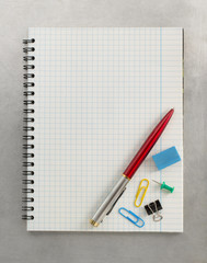 checked notebook at metal background