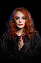 Young witch isolated