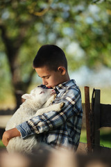 little boy with lamb © Aliaksei Lasevich