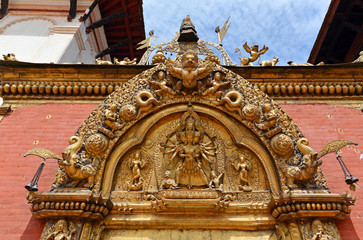 Fototapeta na wymiar The Golden Gate in the Durbar square. Bhaktapur, Kathmandu Nepal